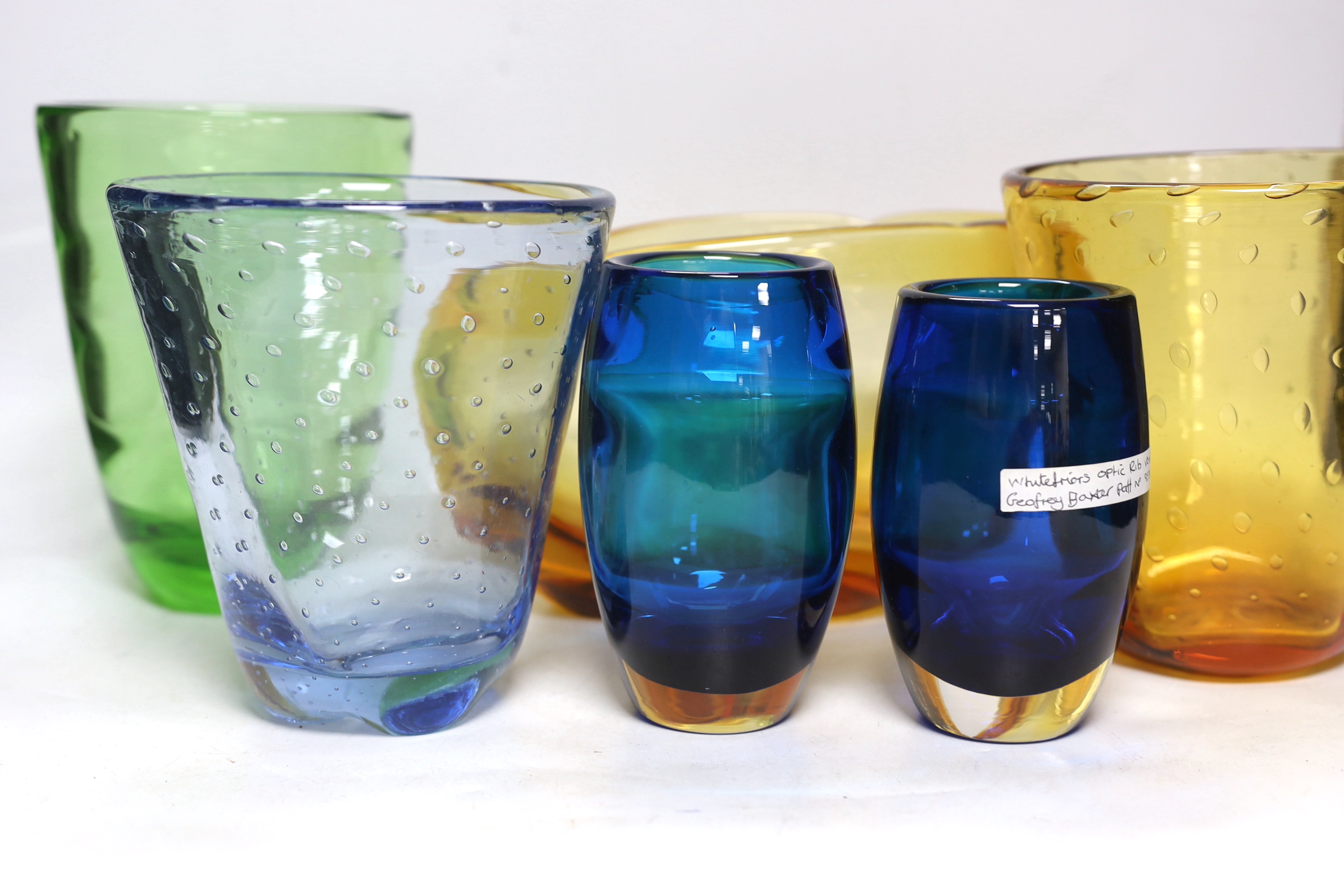 Seven Whitefriars vases including Geoffrey Baxter, optic rib vase and three controlled bubble examples, largest 28cm wide